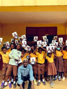 Positive Impact - Yaw Tog donates exercise books to primary school pupils